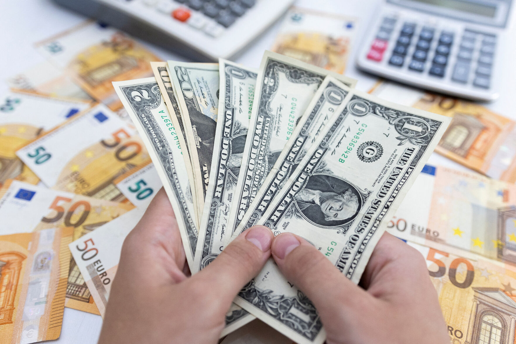 EXPLAINER: What's the impact of euro parity with the dollar?
